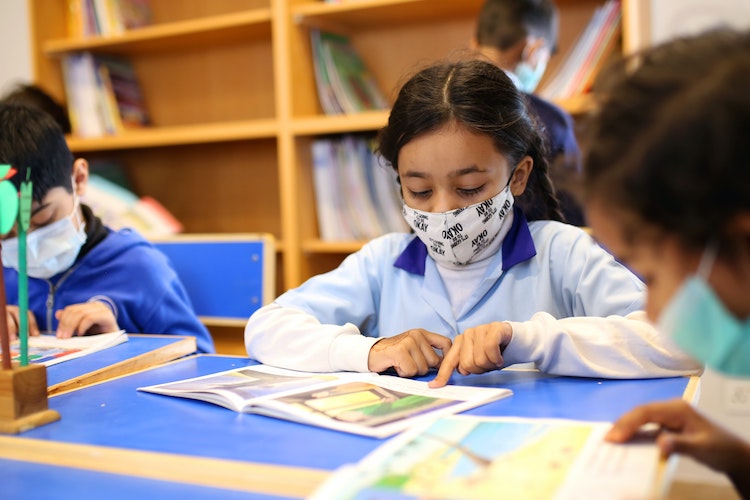 Children in classroom with masks